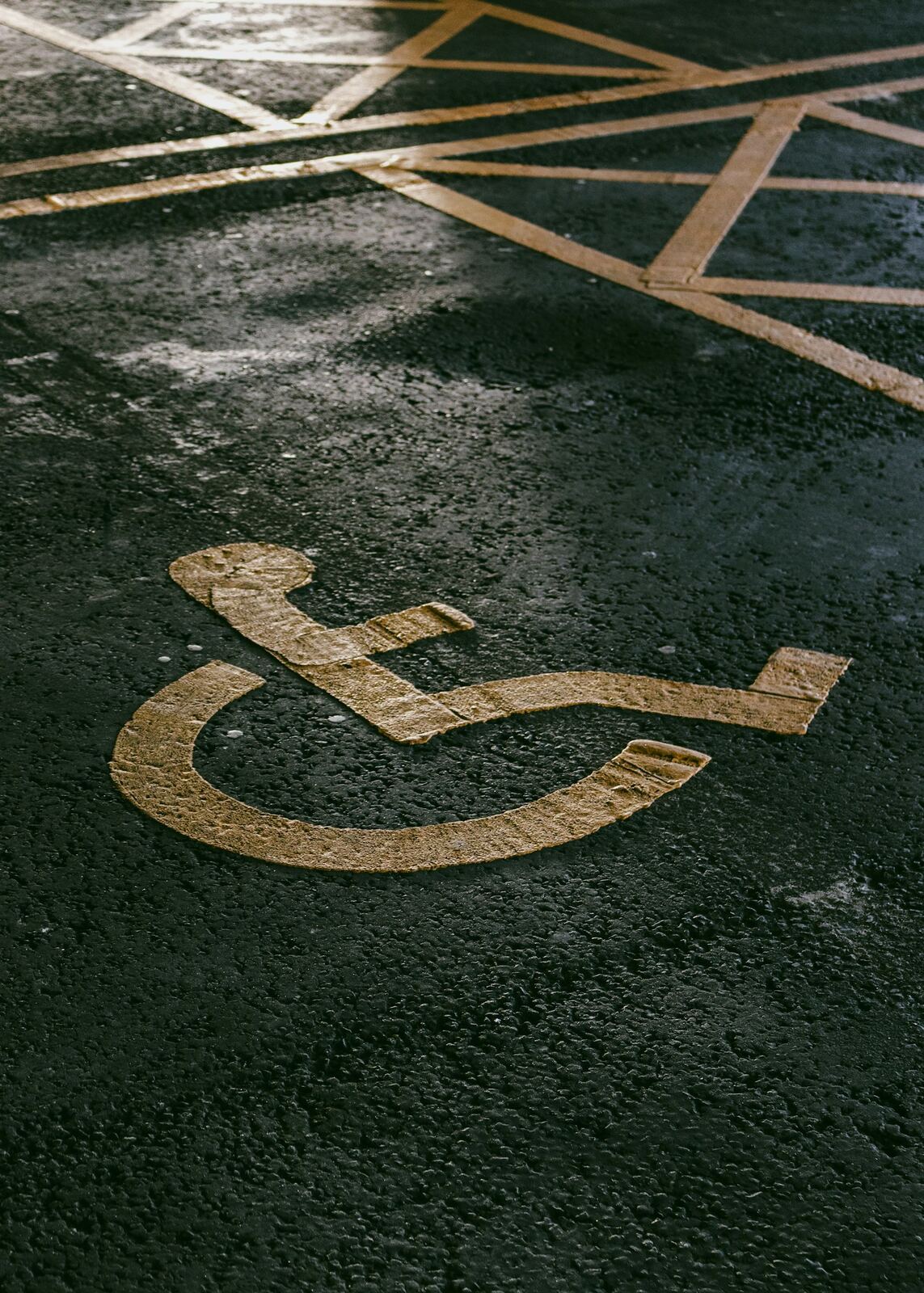 ADA handicap accessible parking symbol painted on pavement