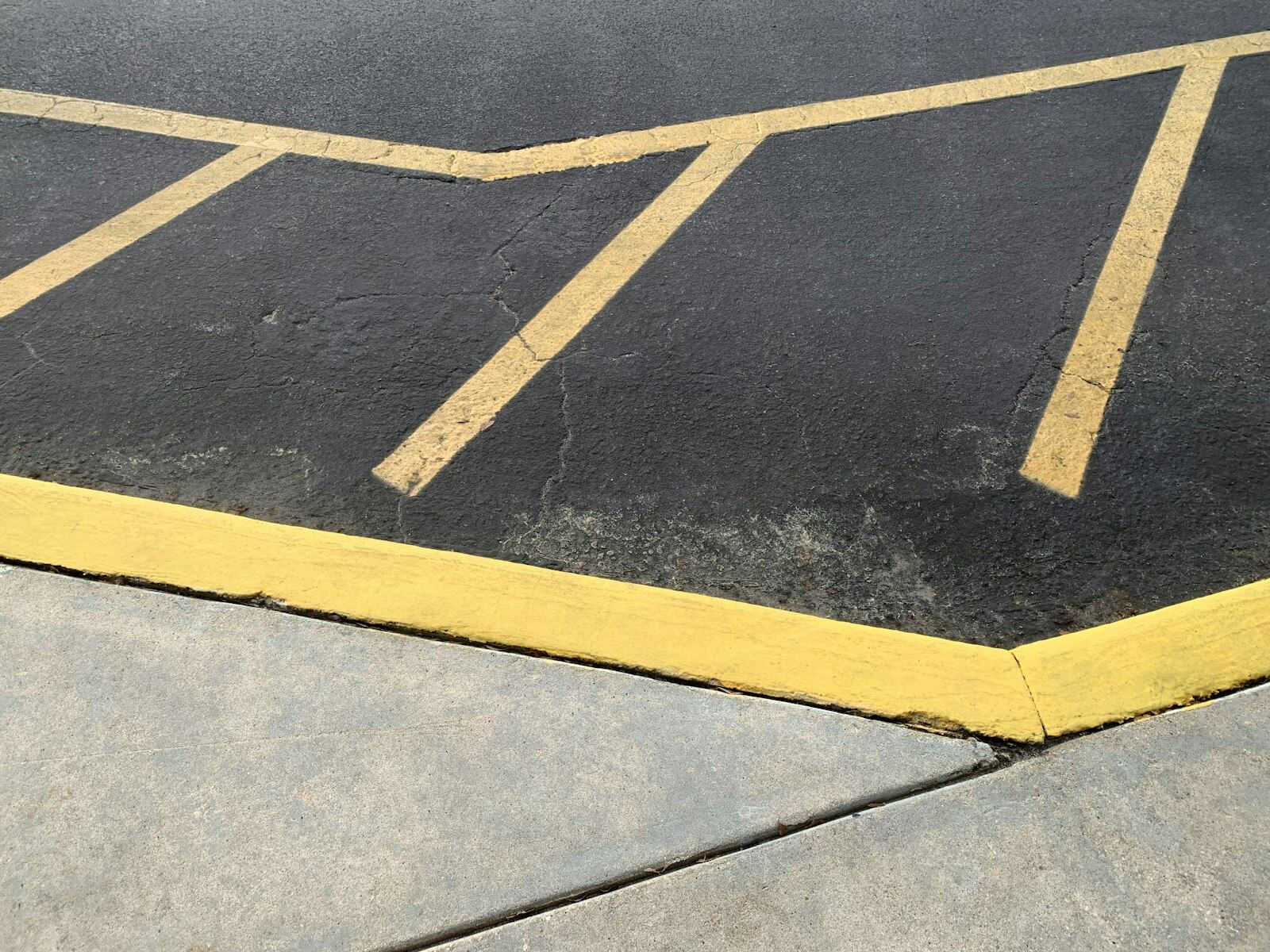 Freshly striped parking lot with yellow line markings